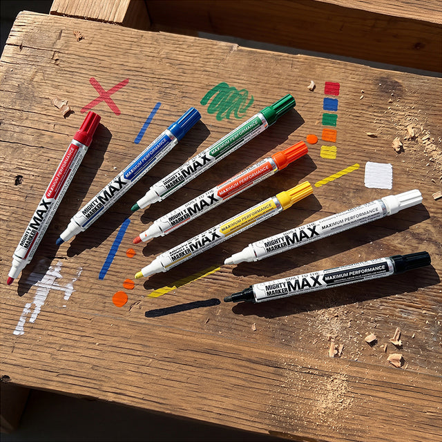 Seven colors of Mighty Marker Max paint markers on wood