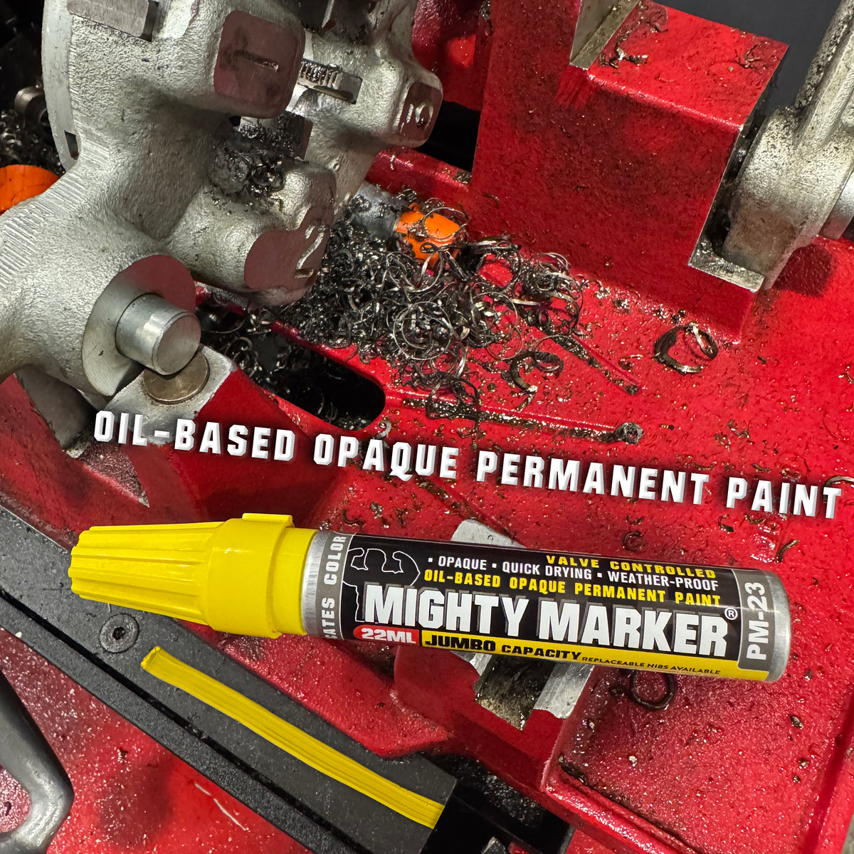 PM-23 Mighty Marker oil-based opaque permanent paint can on a red mechanical surface