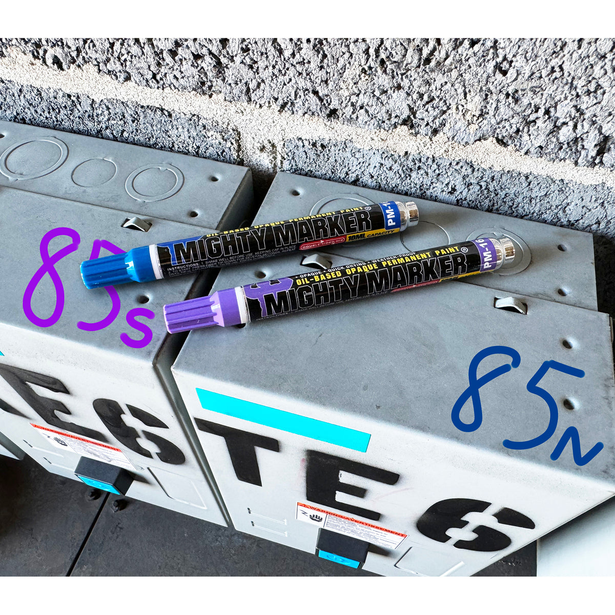 Two Mighty Markers on a license plate with numbers and letters.